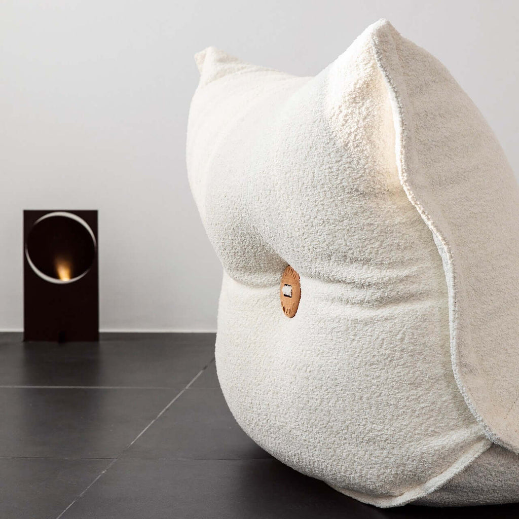 White alpaca boucle caterpillar single sofa lounge chair with floor-standing design