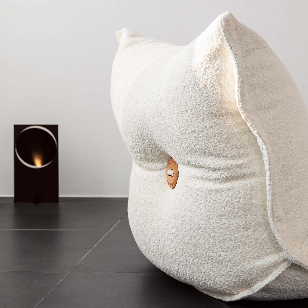 White alpaca boucle caterpillar single sofa lounge chair with floor-standing design