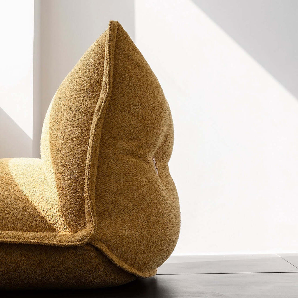 White alpaca boucle caterpillar single sofa lounge chair with floor-standing design