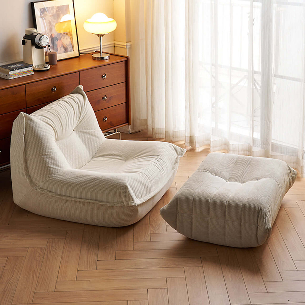 White corduroy single lounge chair with soft recliner design, inspired by Caterpillar Togo sofa