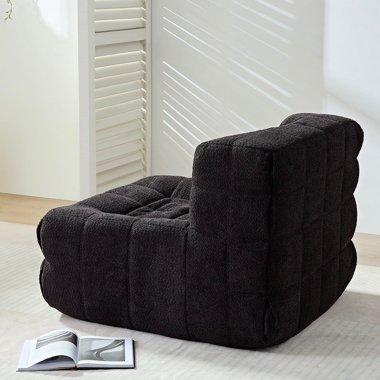 Retro-inspired black square caterpillar chair with plush corduroy fabric