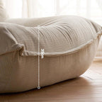 White corduroy single lounge chair with soft recliner design, inspired by Caterpillar Togo sofa