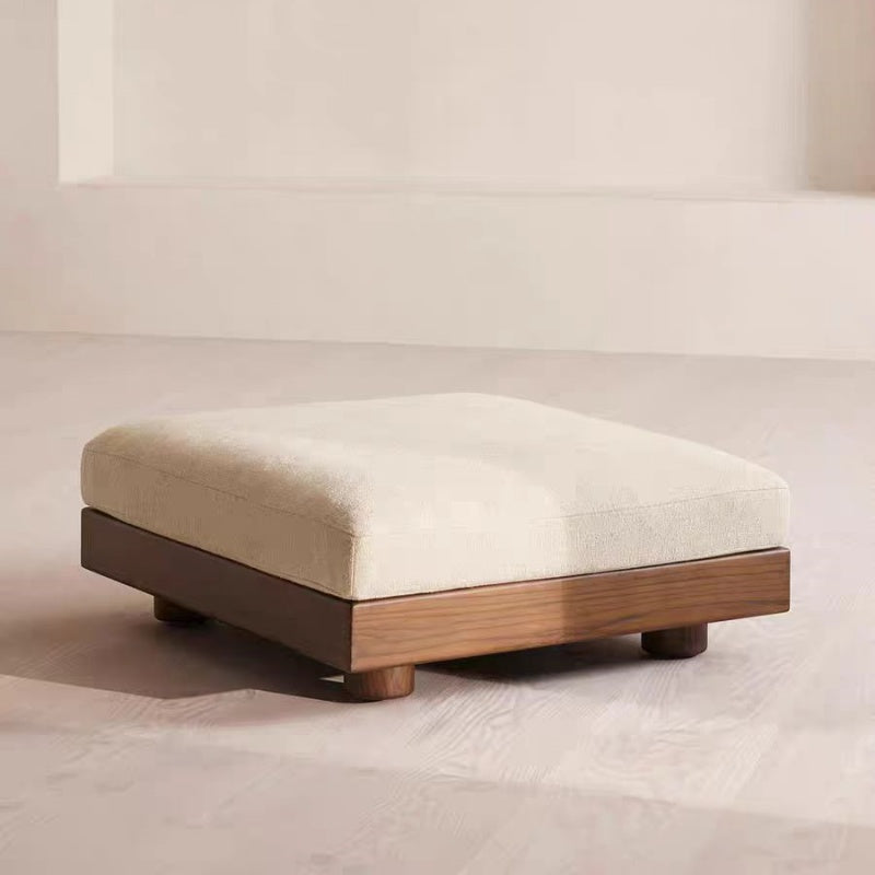 Cream Art Deco floor sofa with pillow back, pillow top arms, slipcover, and multiple pillows for seating 2 to 4 people