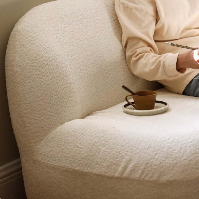 2 seater Nordic white boucle sofa with sherpa upholstery, perfect for a cozy living room