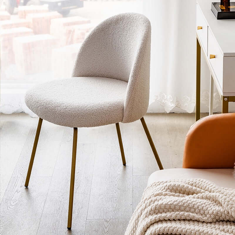 White Nordic vanity stool with elegant gold-tone metal legs for stylish seating