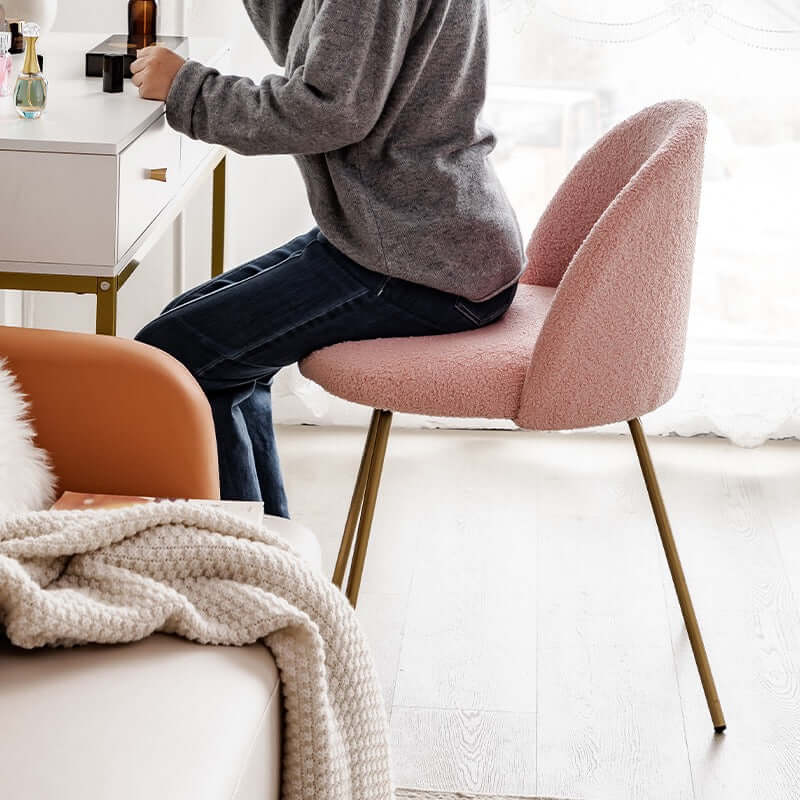 White Nordic vanity stool with elegant gold-tone metal legs for stylish seating