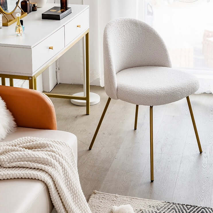 White Nordic vanity stool with elegant gold-tone metal legs for stylish seating