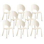 Stackable Scandinavian style dining chair with plastic seat, acrylic back, and silver legs