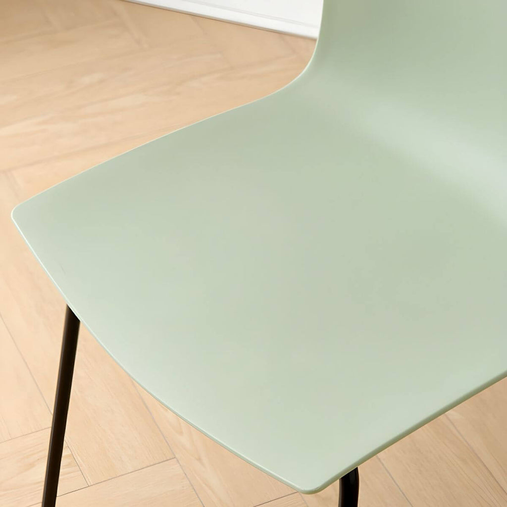 Modern plastic and acrylic side chair with metal legs, ideal for kitchen and dining rooms
