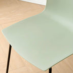 Modern plastic and acrylic side chair with metal legs, ideal for kitchen and dining rooms