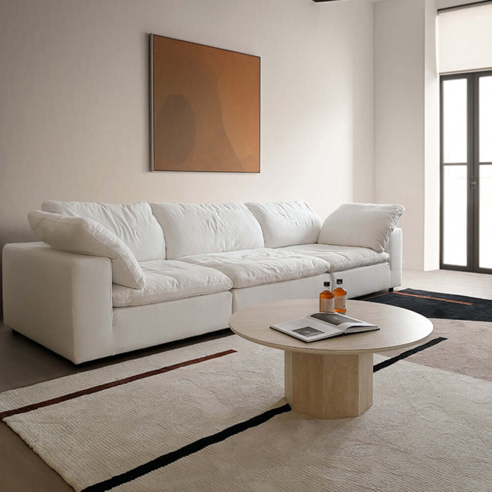 Round Japandi coffee table with beige travertine top and premium wood base