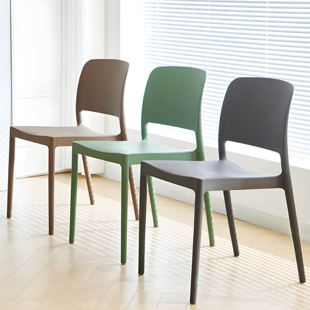 Scandinavian plastic and acrylic dining chair with low backrest and armless design