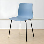 Modern plastic and acrylic side chair with metal legs, ideal for kitchen and dining rooms