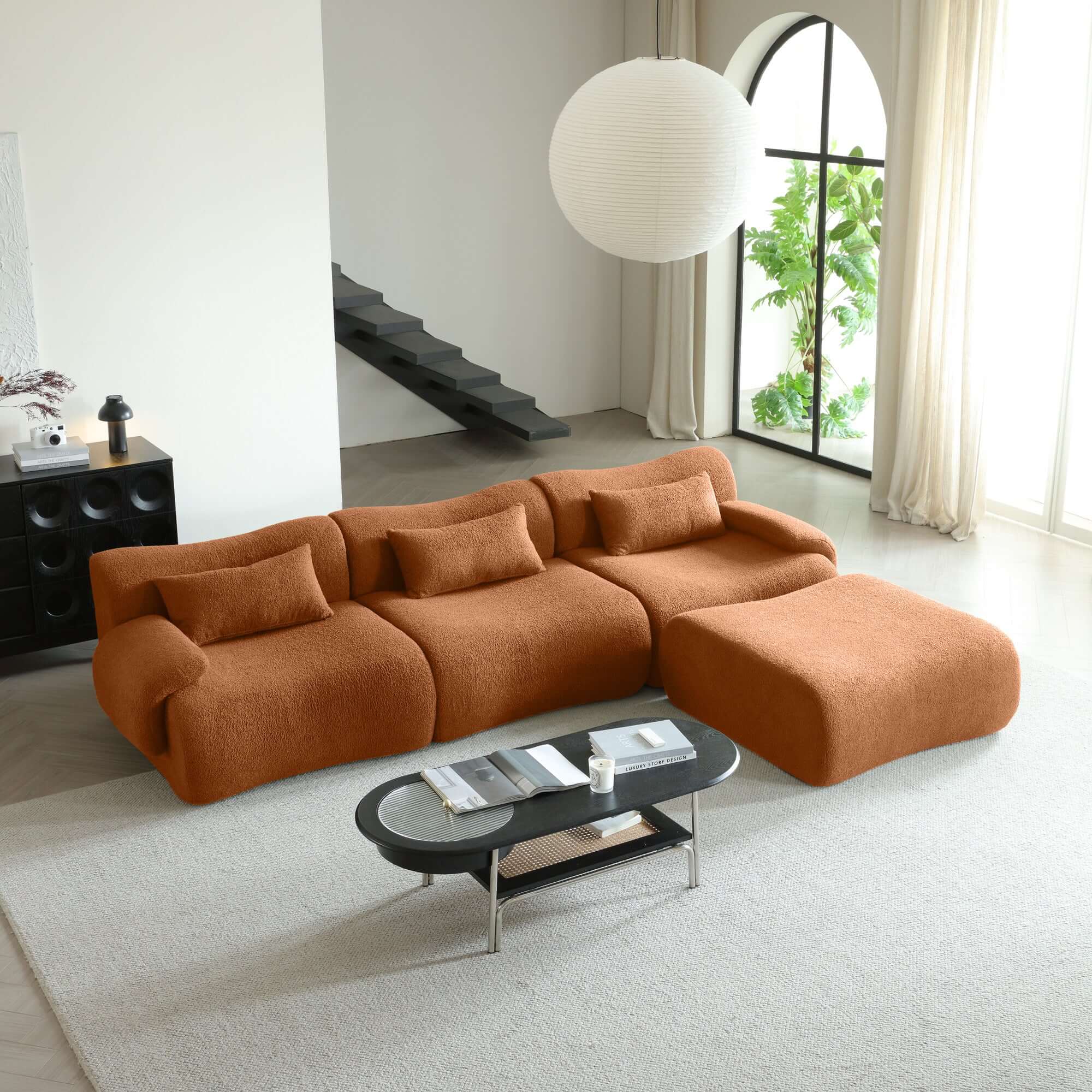 Modern sectional sofa upholstered in soft teddy velvet fabric with modular design