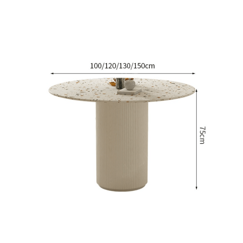 Round terrazzo dining table with soft wool upholstered chairs for a trendy home setup