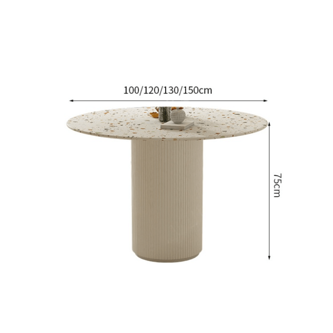 Round terrazzo dining table with soft wool upholstered chairs for a trendy home setup
