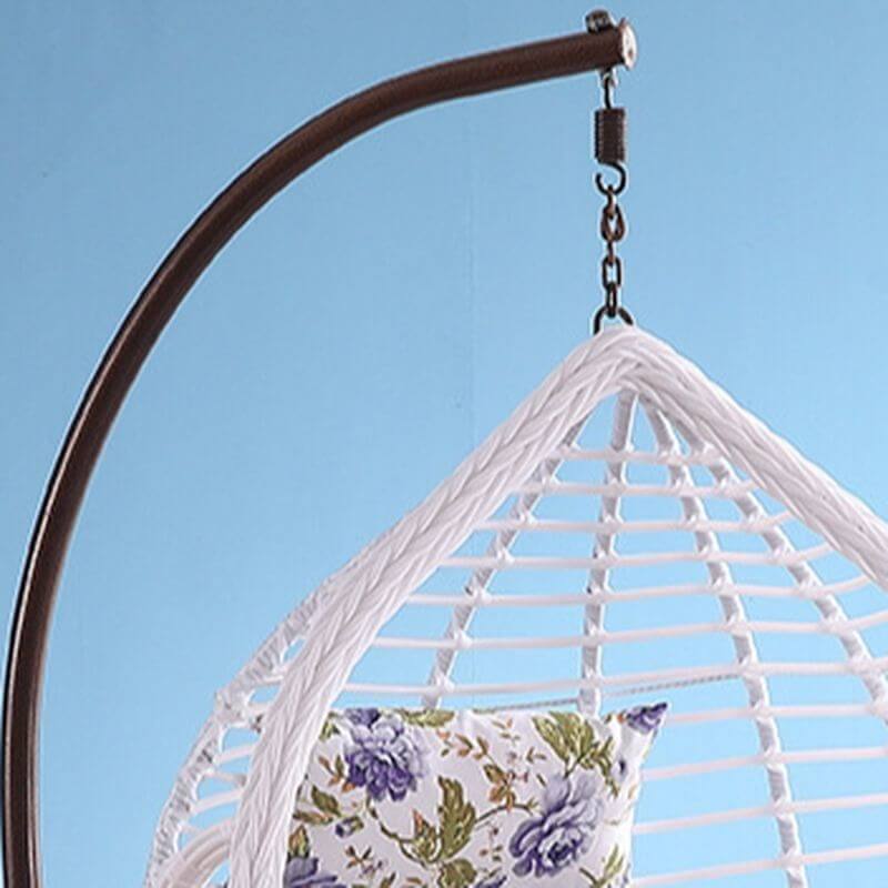 Metal porch swing with cushions, chain, and stand, designed to be heat resistant for outdoor use