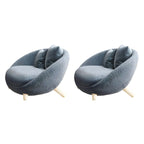 Scandinavian papasan chair with fixed back, sloped arms, cotton blend fabric, and 2 pillows