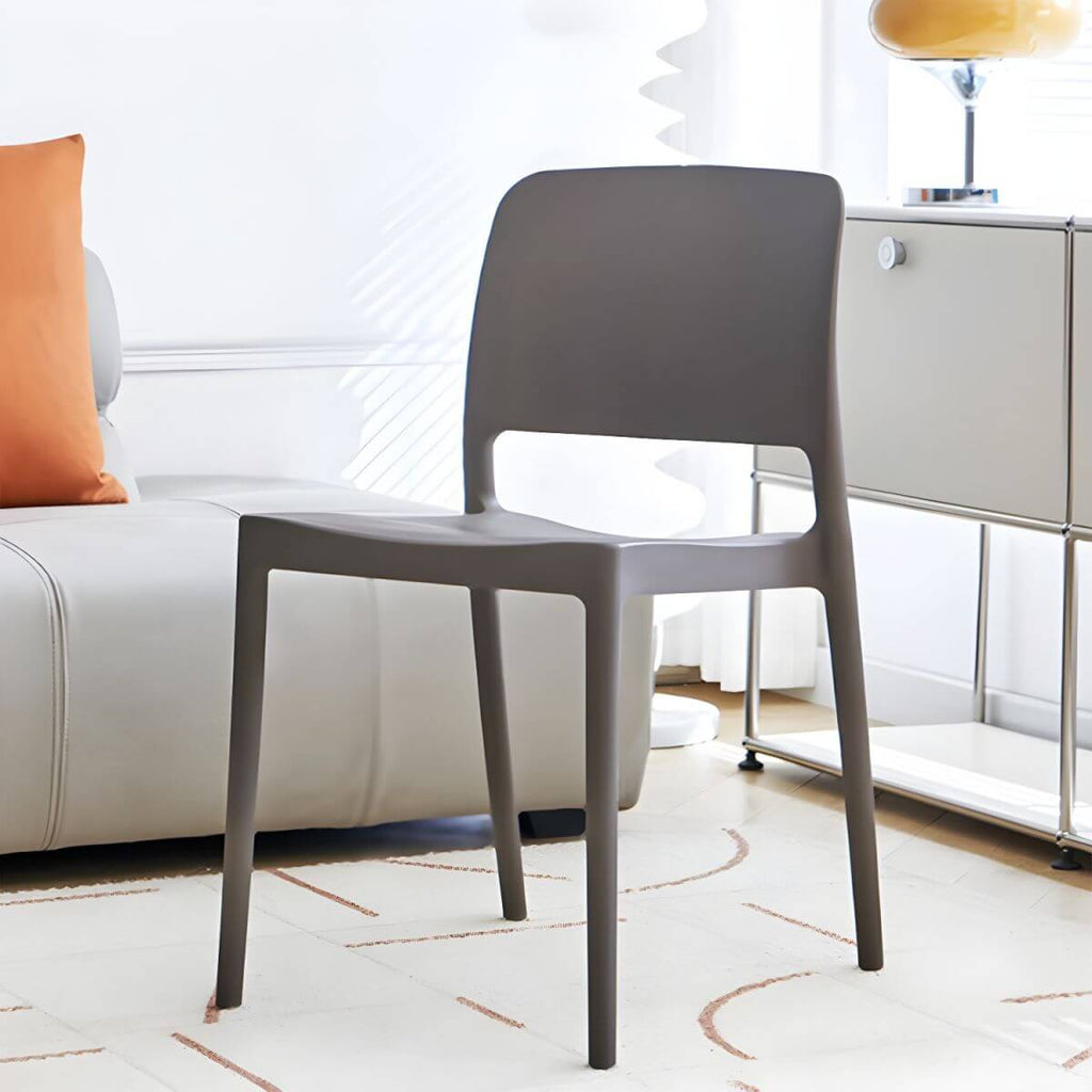 Scandinavian plastic and acrylic dining chair with low backrest and armless design