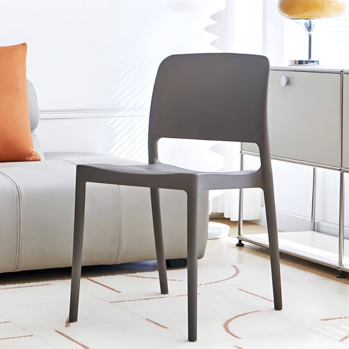 Scandinavian plastic and acrylic dining chair with low backrest and armless design