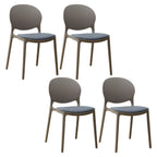 Scandinavian plastic dining chair with open back and four legs, ideal for home use