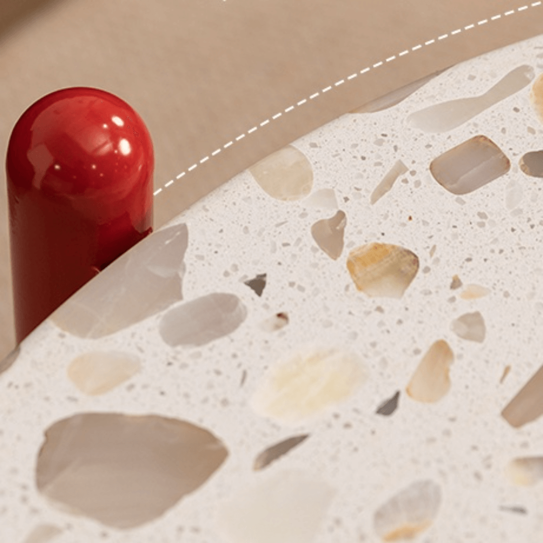 Round side table with vibrant red terrazzo top, featuring a modern minimalist design