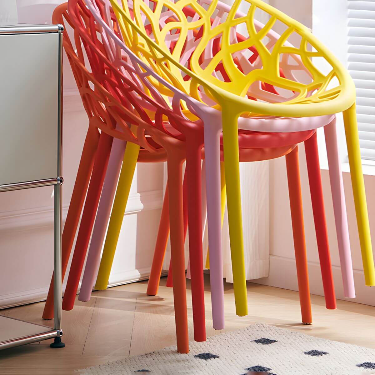 Scandinavian style sloped arm chair made of plastic and acrylic, ideal for kitchen and dining areas