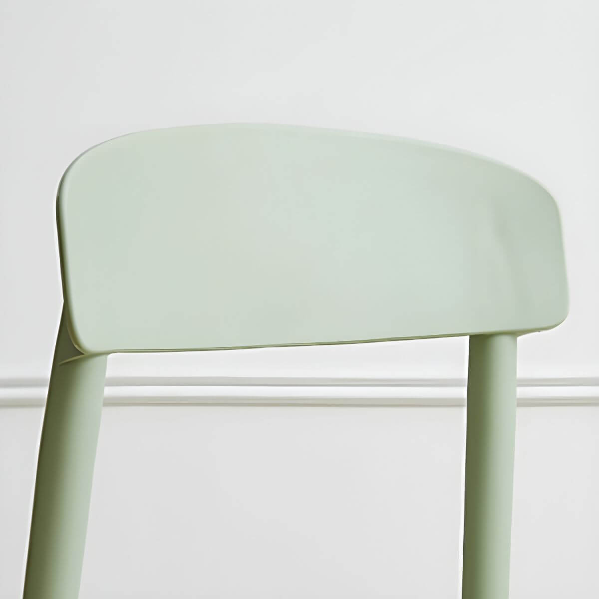 Scandinavian style low back kitchen and dining chair made of plastic and acrylic