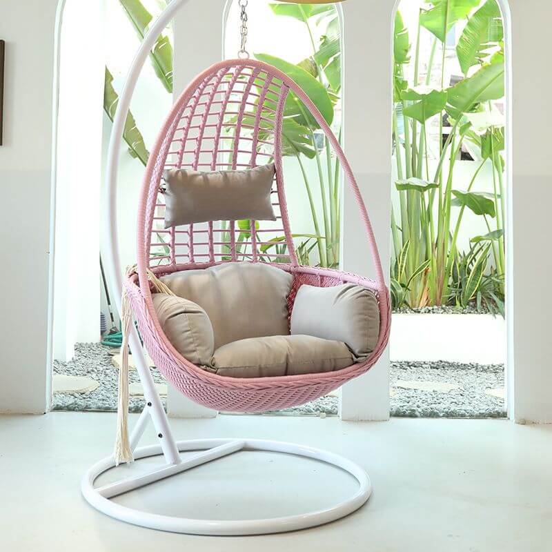 Metal porch swing with tropical olive green, auburn, and rose cushions, includes stand and chain