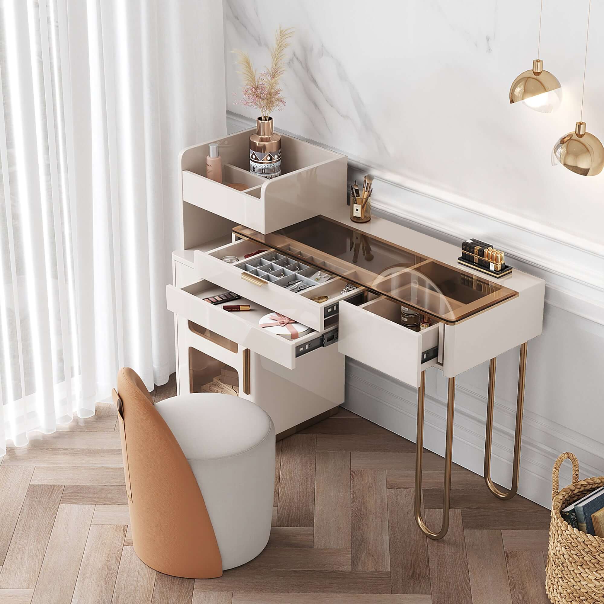 White makeup vanity table with glass tabletop, open storage compartment, drawers, and cabinet