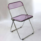 Scandinavian style dining chair with silver metal legs and plastic acrylic seat
