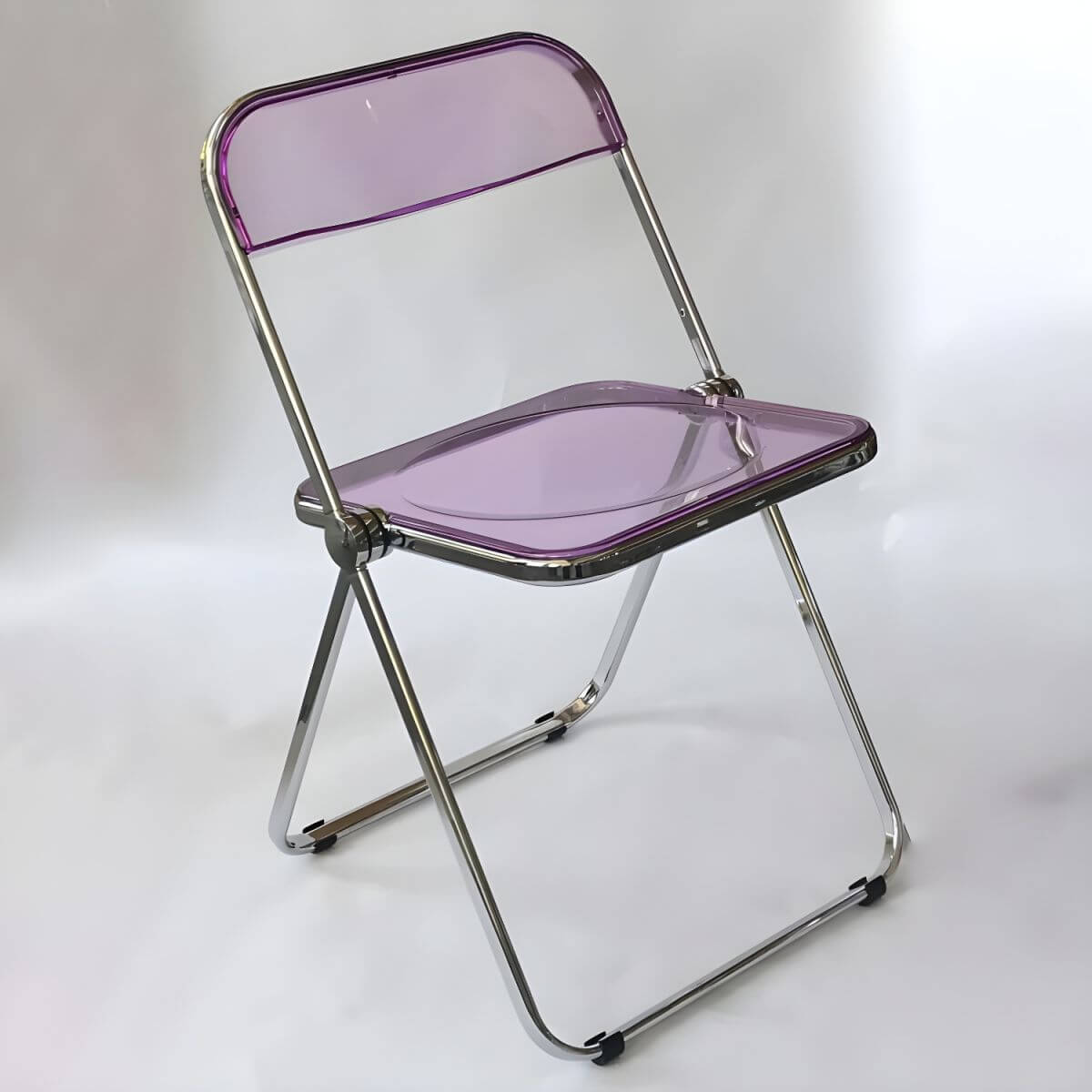 Scandinavian style dining chair with silver metal legs and plastic acrylic seat
