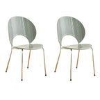 Stackable Scandinavian style dining chair with plastic seat, acrylic back, and silver legs