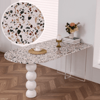 Half-elliptical terrazzo dining table with multicolor mosaic design, durable and stylish
