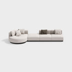 Beige modern L-shaped sectional sofa with pillows and black legs, perfect for corner seating