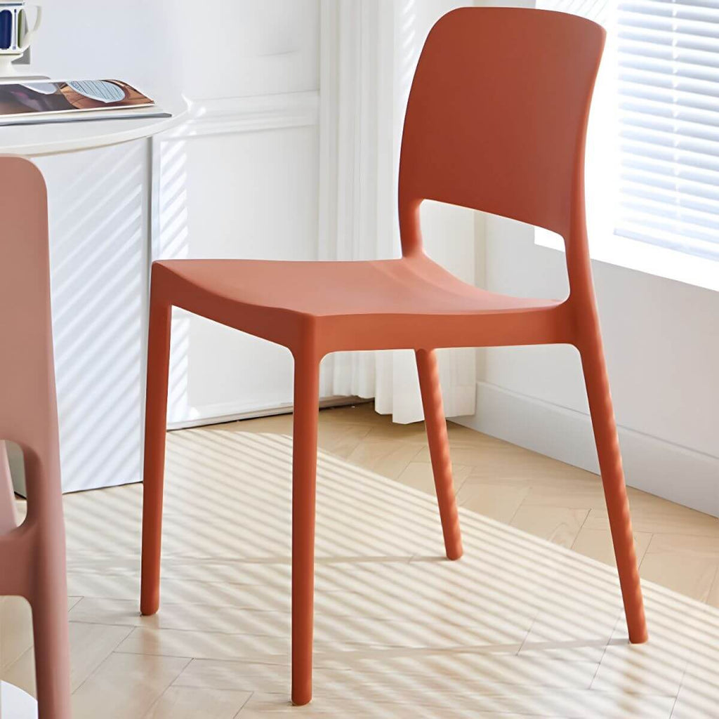 Scandinavian plastic and acrylic dining chair with low backrest and armless design