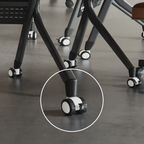 Foldable conference table with modern curve design and comfortable mesh chairs for meetings