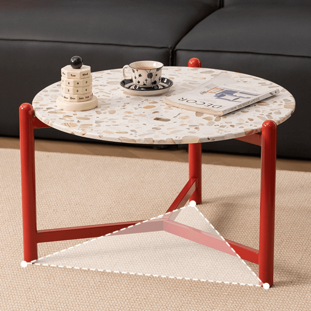 Round side table with vibrant red terrazzo top, featuring a modern minimalist design