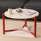 Round side table with vibrant red terrazzo top, featuring a modern minimalist design