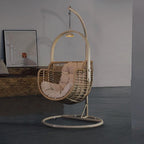 Tropical cocoa and cream upholstered porch swing with alloy frame, stand, and chain included