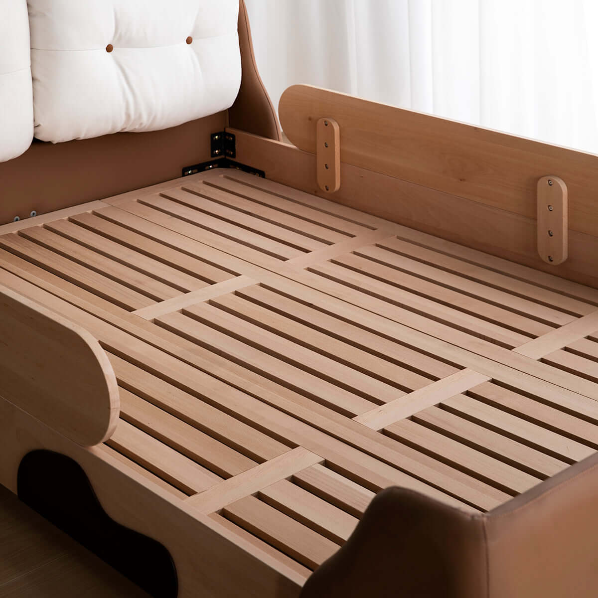 Wooden kid bed with cow design, safety rail, and soft headrest for comfortable sleep