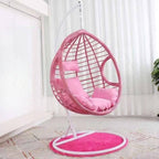 Two-seater metal porch swing egg chair with stand, cushions, and chain included