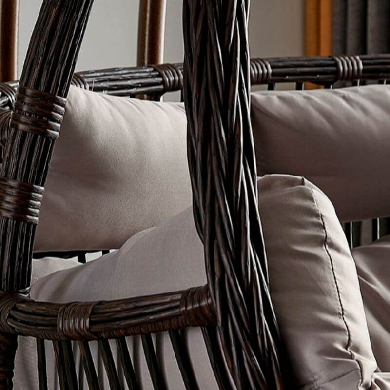 Tropical porch swing with corrosion-resistant cushions, alloy chain, and sturdy stand included