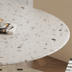 Round terrazzo dining table featuring a stylish wooden and metal base for elegant interiors