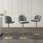 Gray velvet swivel bar stool with curved back and adjustable height, perfect for kitchen or bar seating