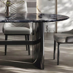 Oval dining table with black marble top and trestle metal base, modern dining room set