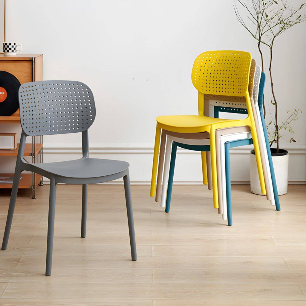 Stackable Scandinavian style plastic and acrylic side chair with low back for dining