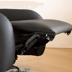 Beige faux leather electric recliner chair with retro U-shaped design, swivel and rocking features