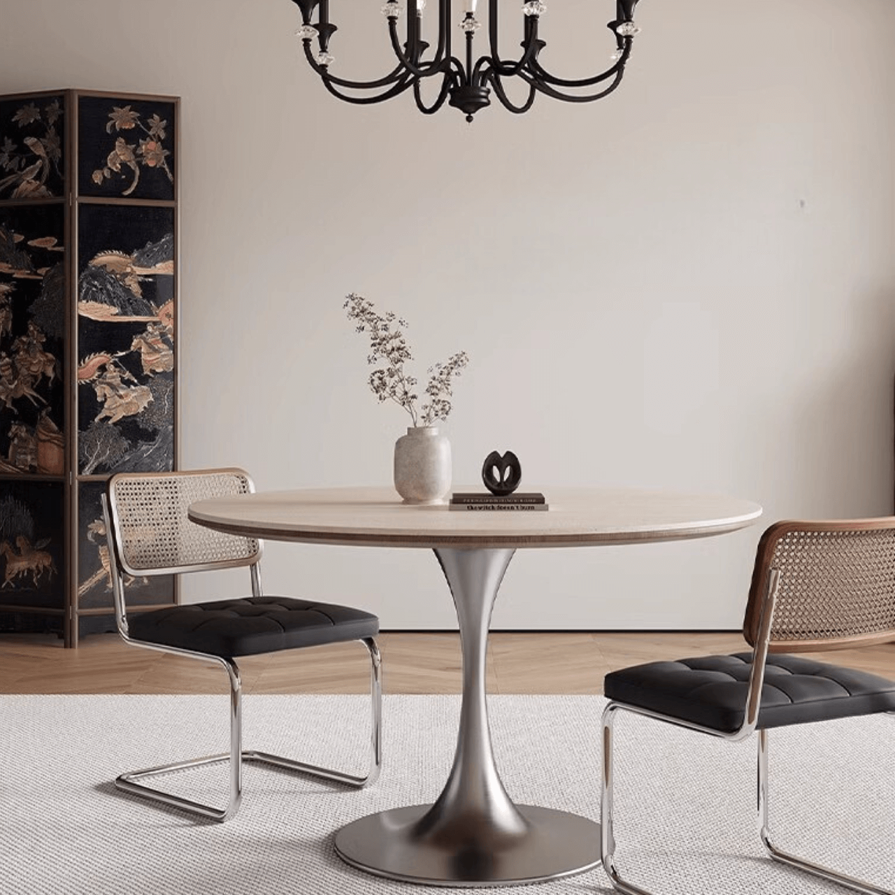Round dining table with beige rock tabletop and stainless steel legs