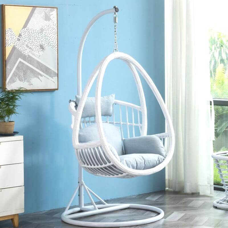 Tropical porch swing with corrosion-resistant cushions, alloy chain, and sturdy stand included